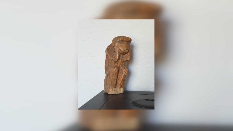 A wooden monkey totem that is everything